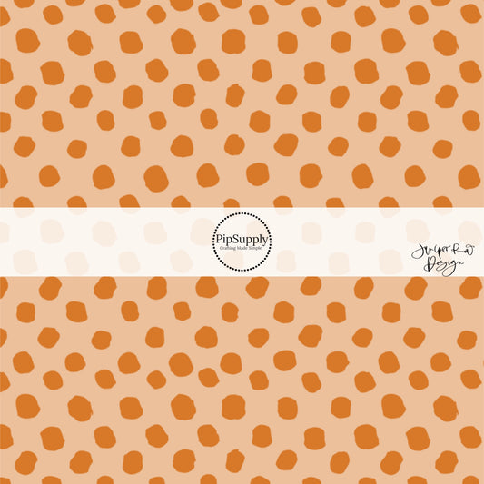 Beige fabric by the yard and apricot speckled dots.