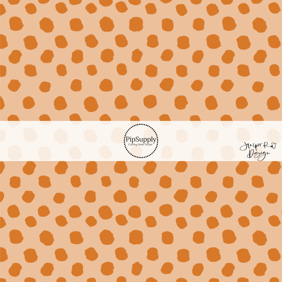 Beige fabric by the yard and apricot speckled dots.