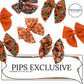 Flowers and pumpkins for fall printed on neoprene fabric to make DIY sailor hair bows
