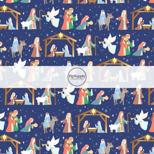 Navy blue fabric by the yard with the nativity scene design.