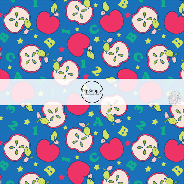 Blue back to school fabric by the yard with sliced apples, stars, letters, and numbers.