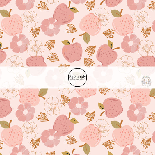 Light pink fabric by the yard with pink apples and pink floral designs.