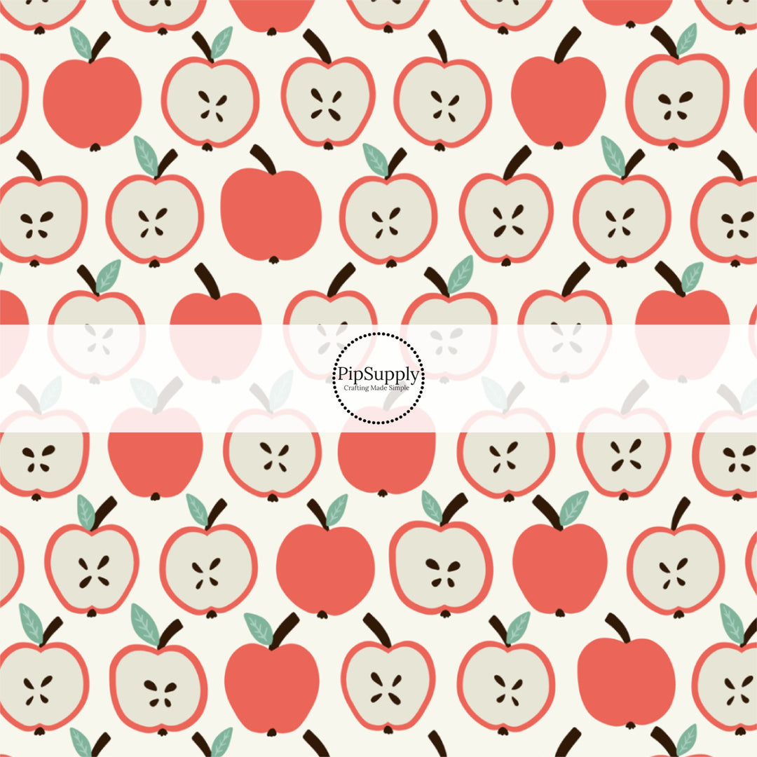 Cream fabric by the yard with sliced red apples.