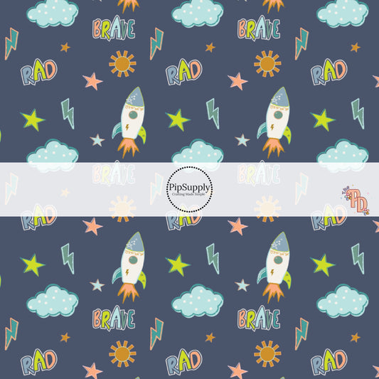 Navy Blue fabric by the yard with stars, space ships, rainbows, and other sky an outer space designs.