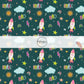 Teal fabric by the yard with stars, space ships, rainbows, and other sky an outer space designs.