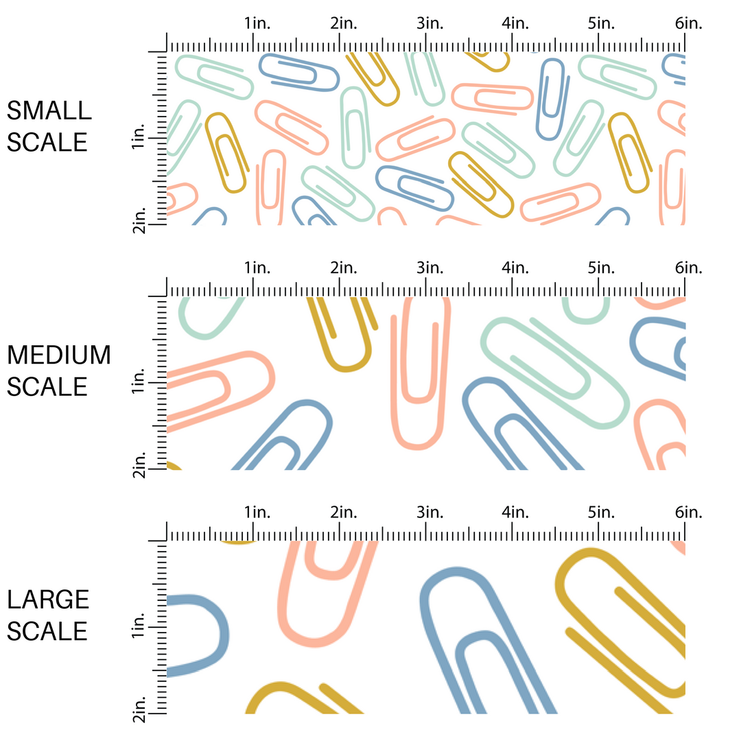 Peach, yellow, aqua, and blue paper clips on white fabric by the yard scaled image guide.