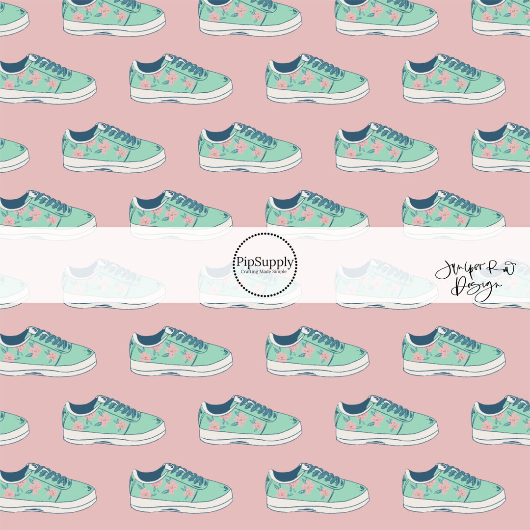 Teal sneakers with light pink flowers on rosy pink fabric by the yard.