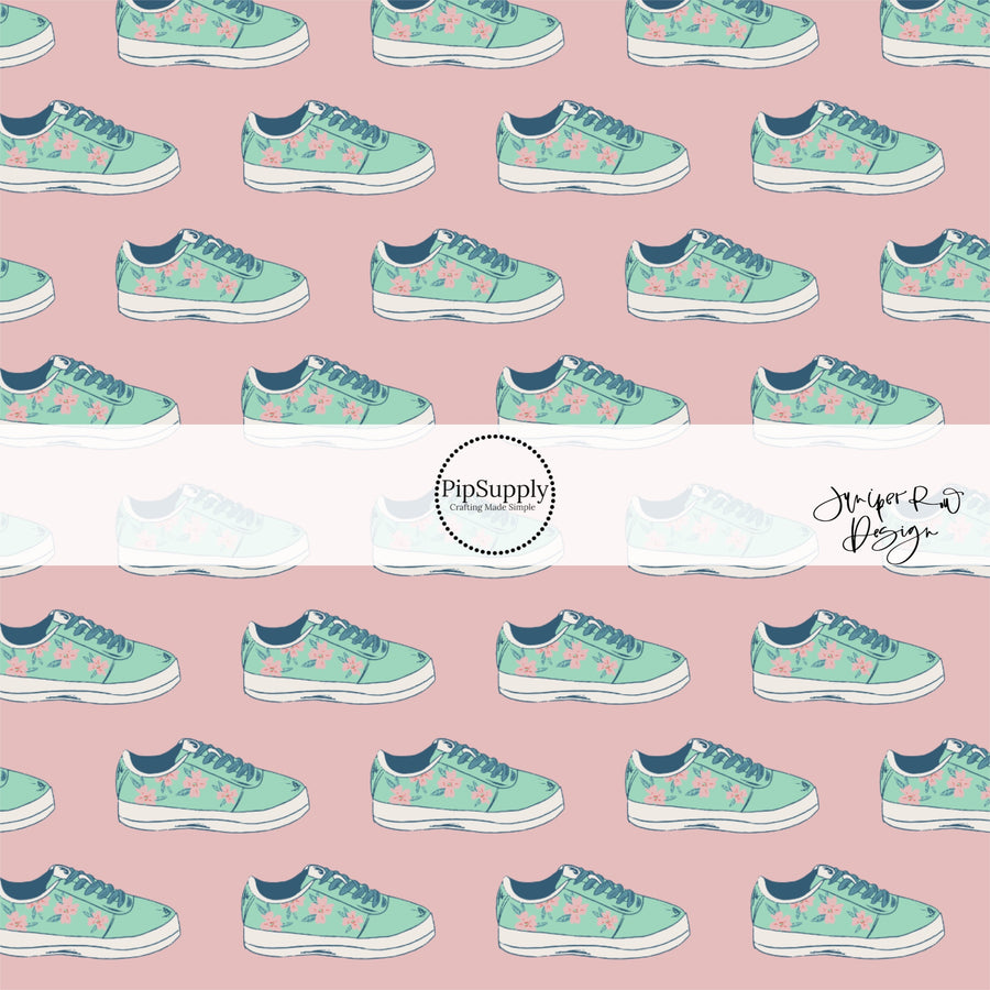 Teal sneakers with light pink flowers on rosy pink fabric by the yard.