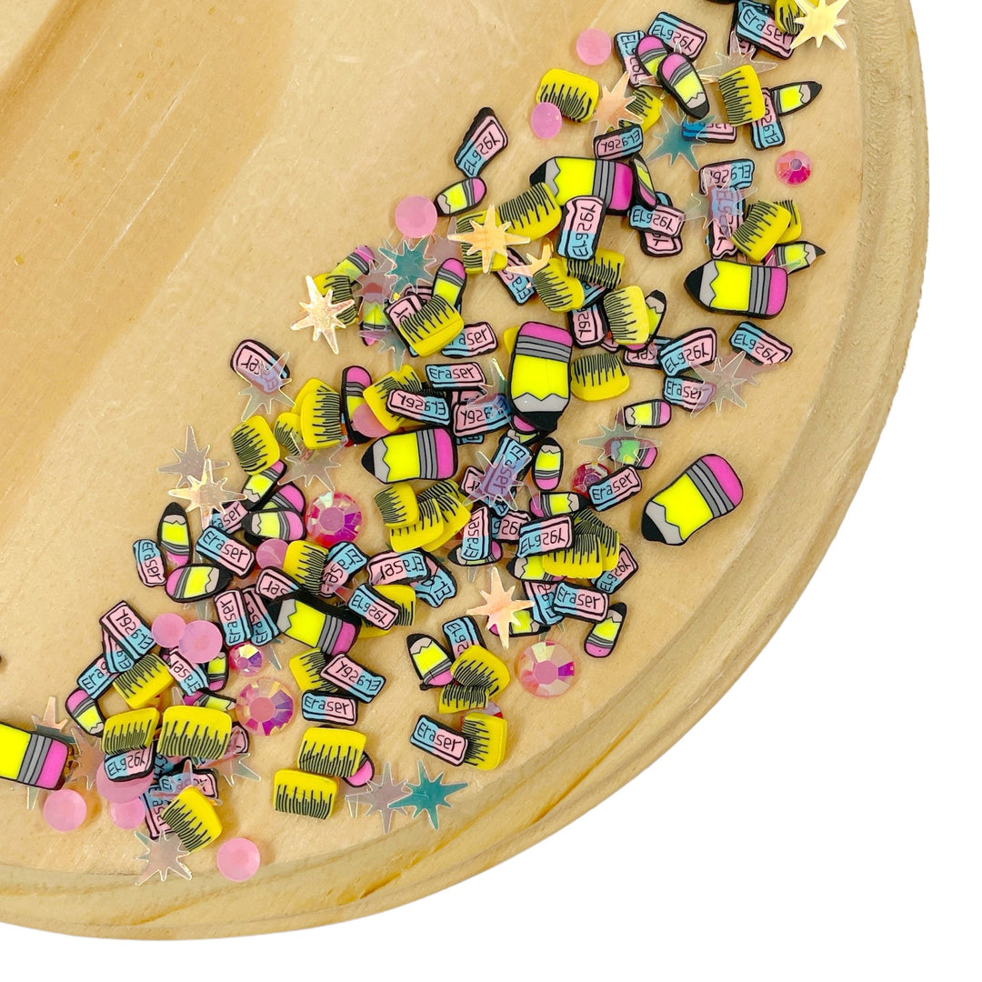 Back to school polymer pieces. Pencil, rulers, erasers and sequins
You can use it to add sparkle and decoration to resin projects, filling for shaker bows, slime making, party decor, scrapbooking, card making and nail art.

 This loose clay mix is sold in a resealable 1 OZ Bag

- Material: Polymer Clay and Glitter