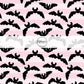 Pink striped fabric by the yard with flying black bats.