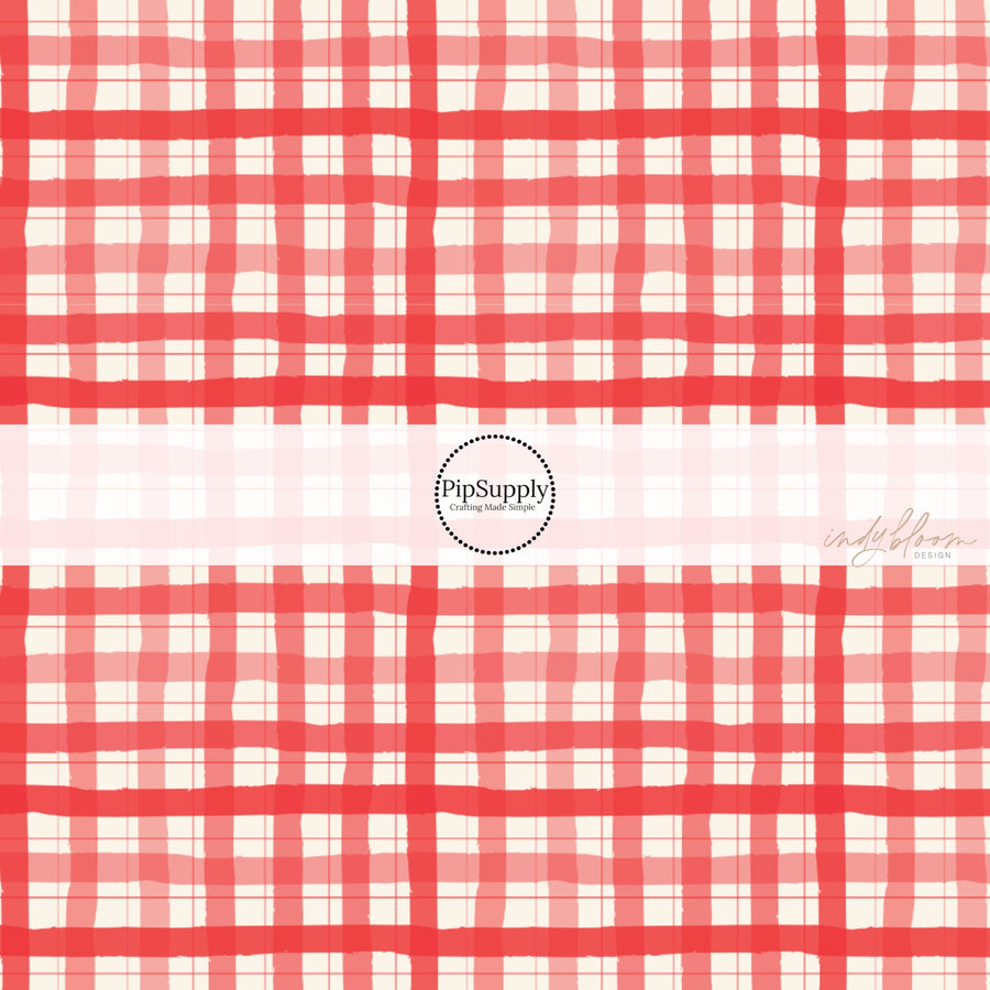 These holiday pattern themed fabric by the yard features red and cream plaid pattern. This fun Christmas fabric can be used for all your sewing and crafting needs!