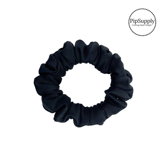 These black swim scrunchies have a two layer swimsuit fabric strip with edges that are securely folded and sewn providing a professional and high quality seam. Fabric is thick high quality not coarse or stiff with elastic band sewn inside for stretch-ability. Pattern visible on all sides. 