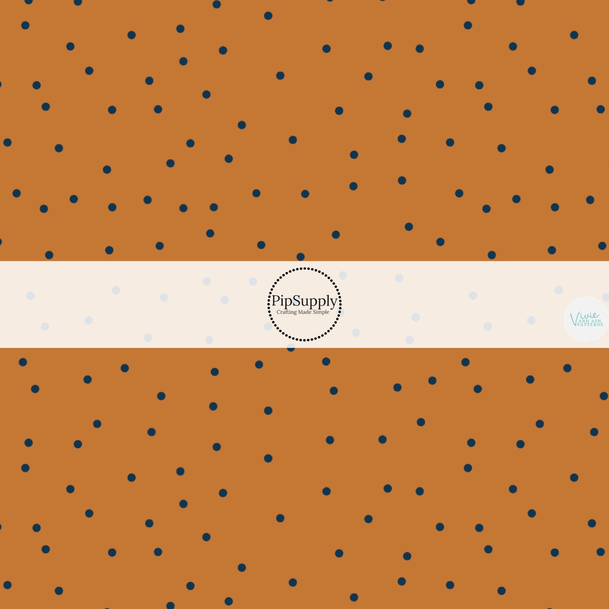 Pumpkin orange colored fabric by the yard with scattered black dots.