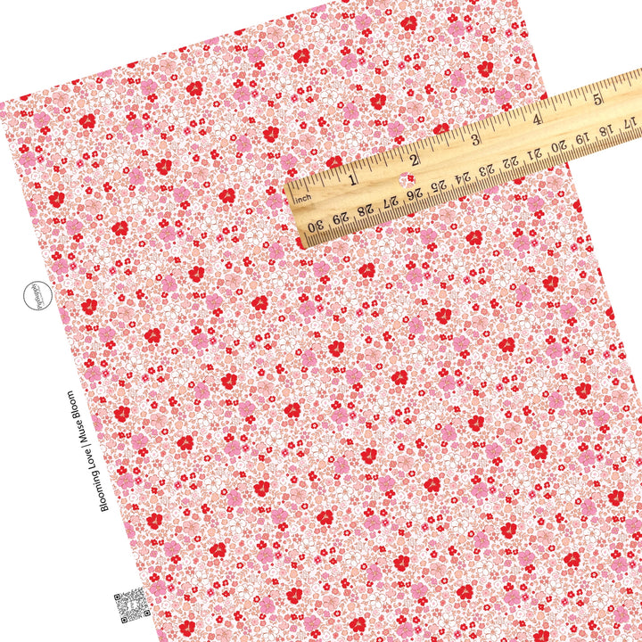 These Valentine's pattern themed faux leather sheets contain the following design elements: small pink, peach, red, and white flowers on light pink. Our CPSIA compliant faux leather sheets or rolls can be used for all types of crafting projects.