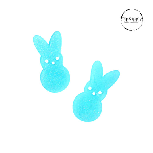 This cute Easter embellishment is a sparkly blue color. The glitter embellishment is in a bunny shape. Add this to your newest Easter or Spring creation.
