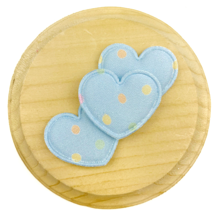 Light blue heart-shaped appliqués featuring scattered pastel polka dots in yellow, peach, pink, and soft green, finished with a matching satin-stitched embroidered border for a charming, airy, and playful look.
Heart Appliques
Sets of 3
Approx 35 mm x 28 mm