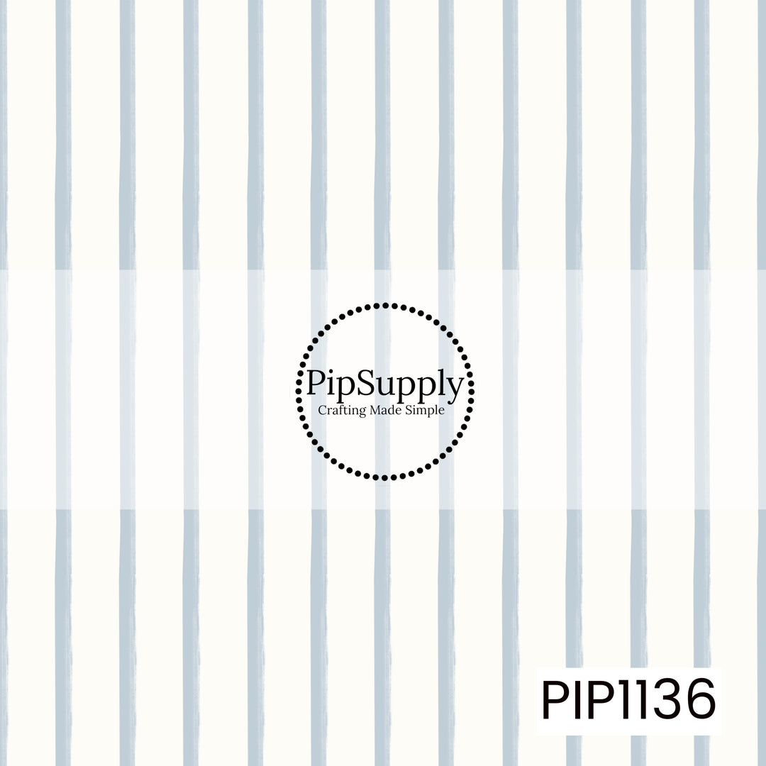 A timeless pattern of softly hand-painted powder-blue vertical stripes on a warm ivory background, creating a clean and charming coordinate design.
