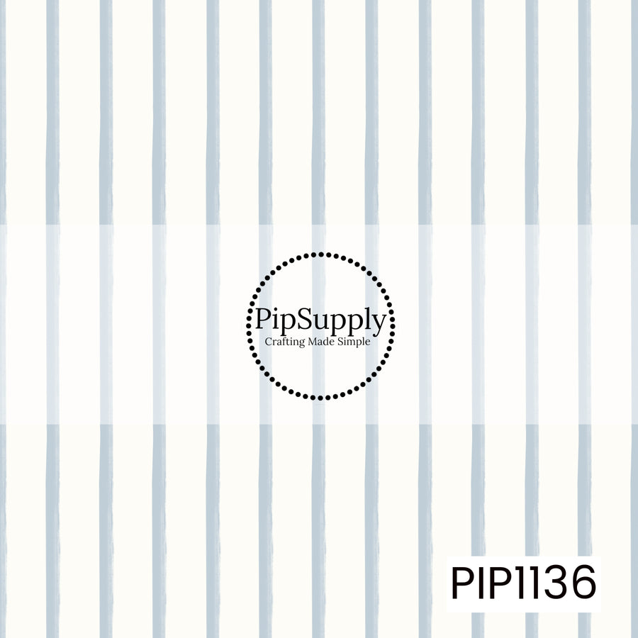A timeless pattern of softly hand-painted powder-blue vertical stripes on a warm ivory background, creating a clean and charming coordinate design.
