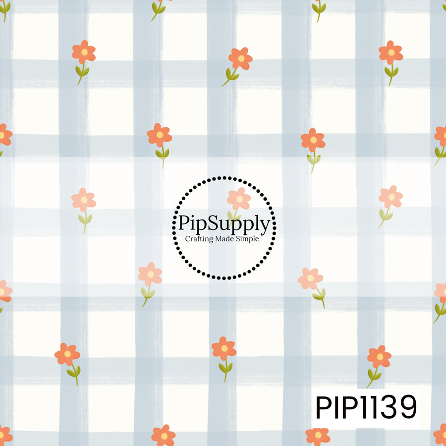 A playful hand-painted pattern featuring coral-orange flowers with yellow centers and green leaves scattered across an oversized powder-blue and white checkered background.
