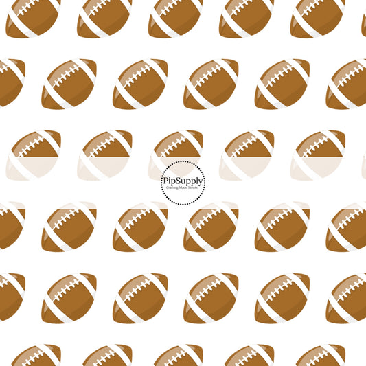 Brown and White Footballs in rows on white fabric by the yard.