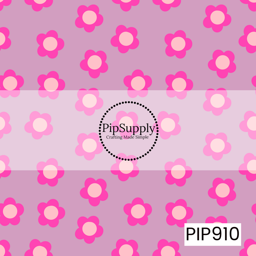 A playful scattered floral pattern featuring simple five-petal flowers in vibrant hot pink with soft blush centers, tossed across a muted lavender background.