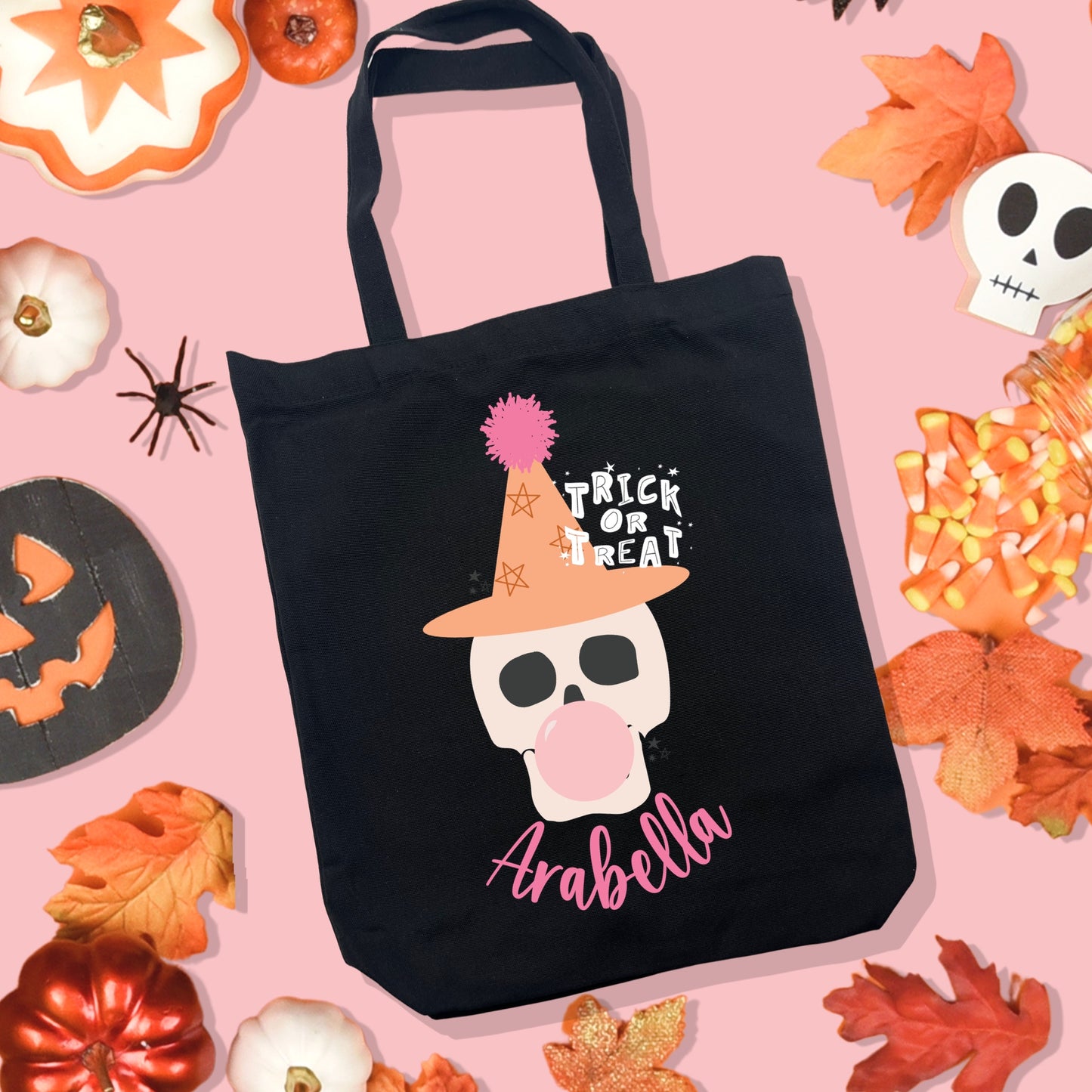 Black Halloween Tote Bag with a Skeleton Skull wearing a orange witch hat and blowing bubblegum. Personalized Halloween Trick or Treat Bag