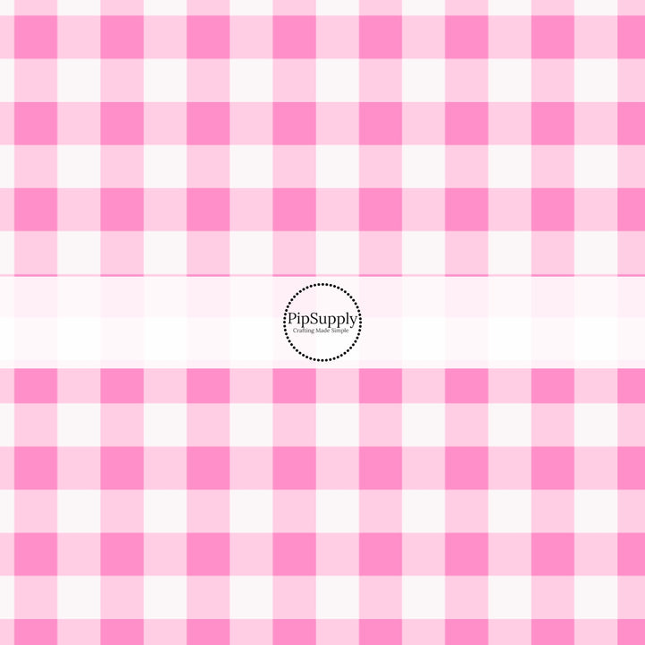 These holiday pattern themed fabric by the yard features light pink and white plaid pattern. This fun Christmas fabric can be used for all your sewing and crafting needs!