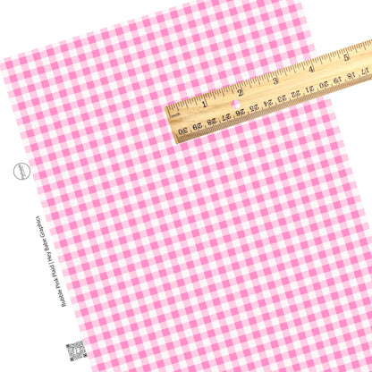 These holiday themed faux leather sheets contain the following design elements: light pink and white plaid pattern. Our CPSIA compliant faux leather sheets or rolls can be used for all types of crafting projects.
