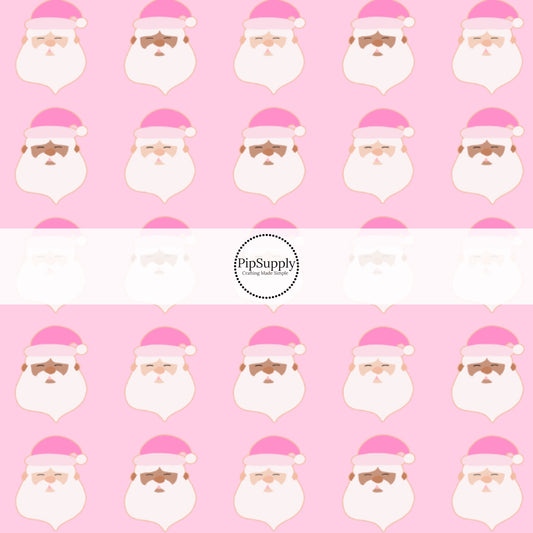 These holiday pattern themed fabric by the yard features Santas with pink Christmas hats on light pink. This fun Christmas fabric can be used for all your sewing and crafting needs!