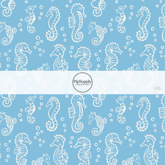 This ocean fabric by the yard features white seahorses on blue. This fun themed fabric can be used for all your sewing and crafting needs!