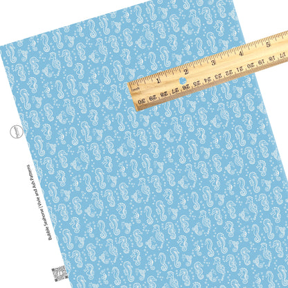 These ocean faux leather sheets contain the following design elements: white seahorses on blue. Our CPSIA compliant faux leather sheets or rolls can be used for all types of crafting projects.