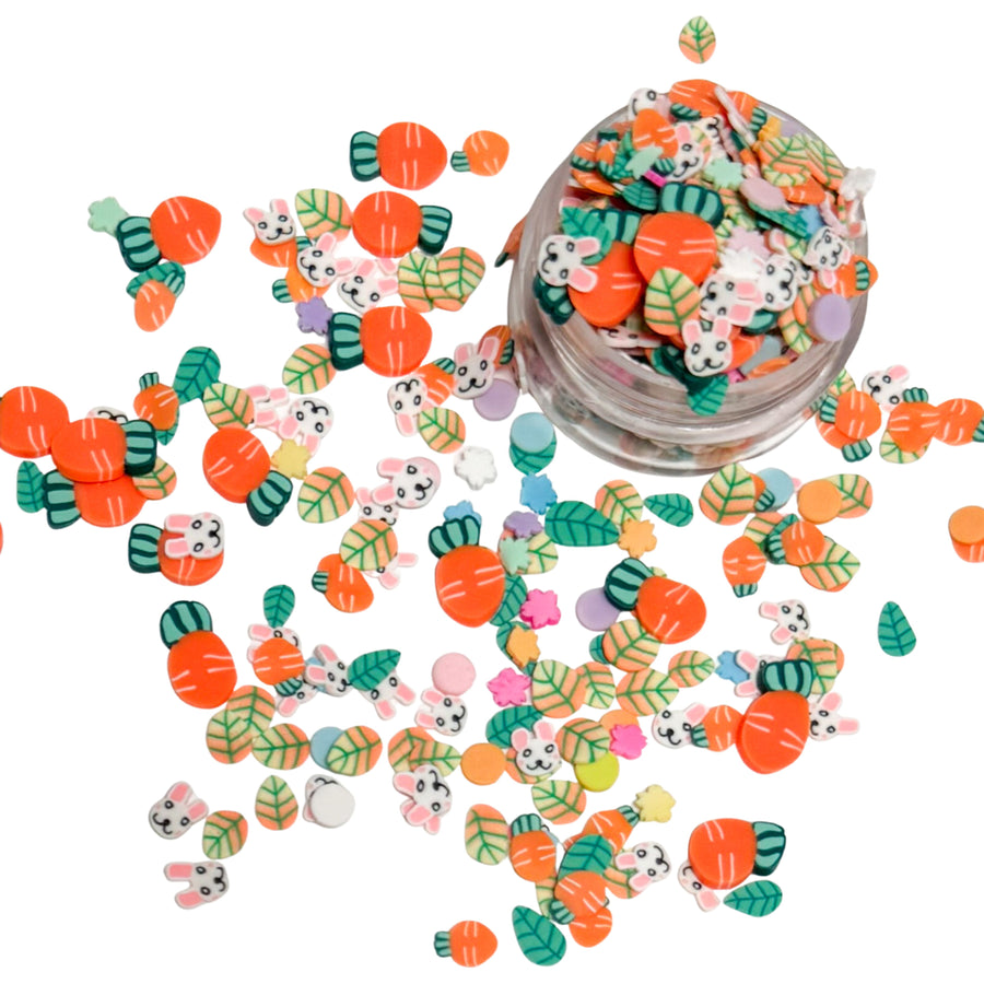 clay pieces shaped as carrots, bunnies, green and orange leaves, and multi colored flowers
 
You can use it to add sparkle and decoration to resin projects, filling for shaker bows, slime making, party decor, scrapbooking, card making and nail art.

 This loose clay mix is sold in a resealable 1 oz Bag

- Material: Polymer Clay and Glitter