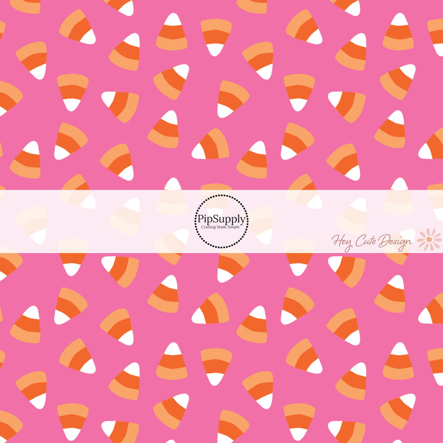 These Halloween themed pink fabric by the yard features candy corn on hot pink. This fun spooky themed fabric can be used for all your sewing and crafting needs! 