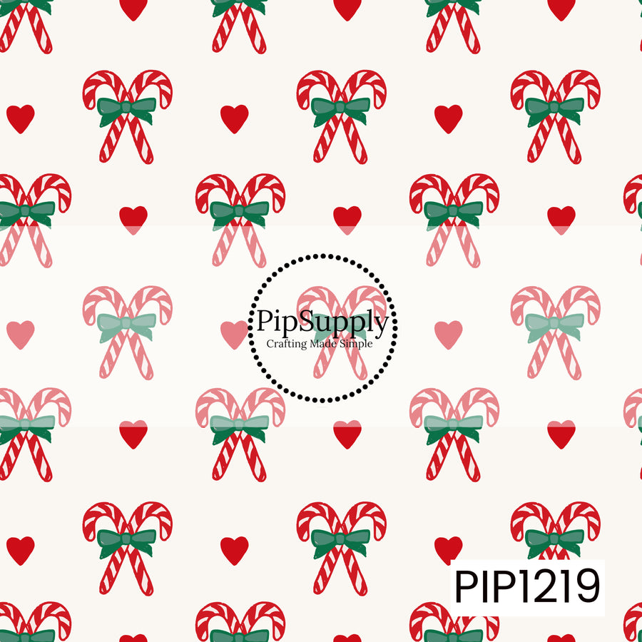 A sweet Christmas pattern featuring crossed red and white candy canes tied together with deep green bows. Small red hearts are scattered between the candy cane clusters on a warm cream background, creating a simple and playful holiday design.
