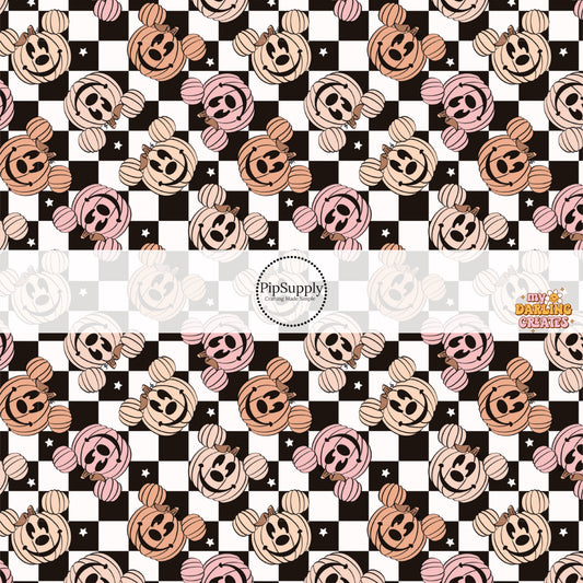 White and black checkered fabric by the yard with pink and orange mouse jack-o-lanterns and stars.