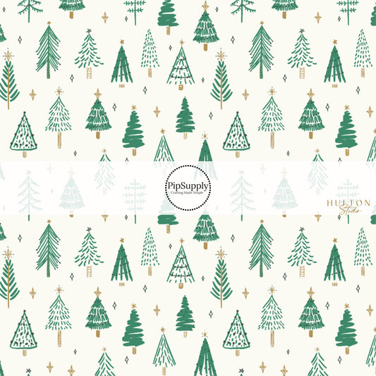 Cream fabric by the yard with scattered green Christmas trees and stars.