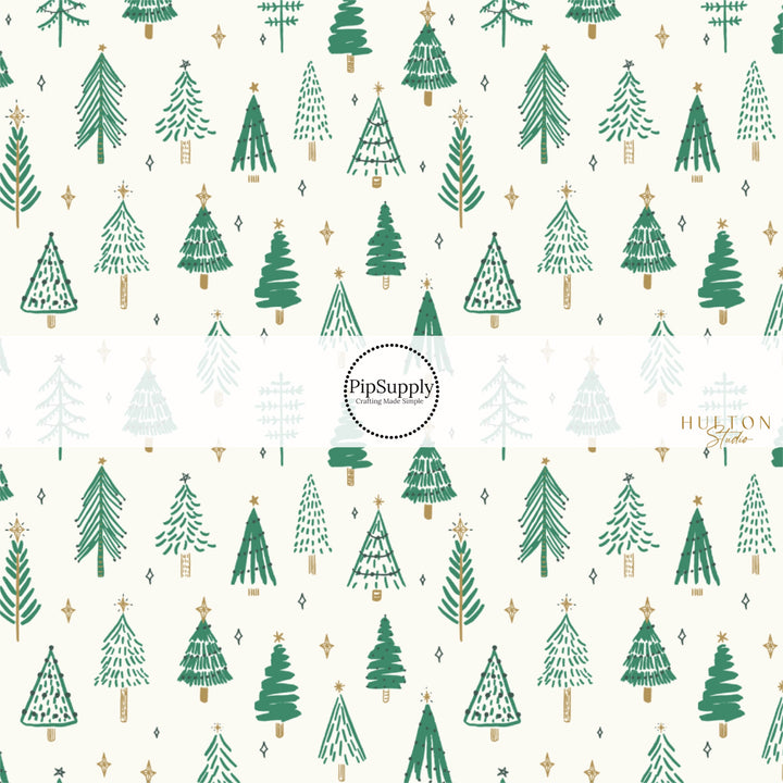 Cream fabric by the yard with scattered green Christmas trees and stars.