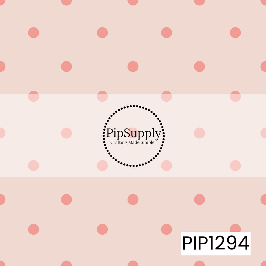 A simple, sweet polka dot pattern featuring soft coral pink dots evenly scattered across a creamy blush background. The warm pastel palette gives it a soft, playful look.
