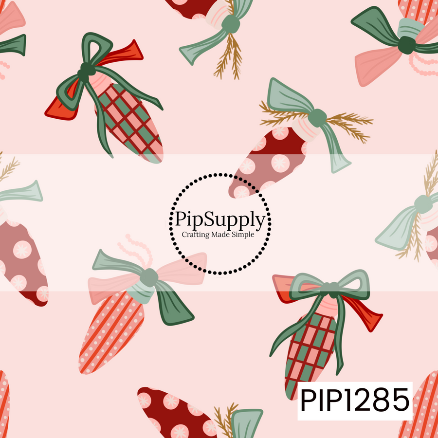 A whimsical Christmas ornament pattern featuring playful plaid, striped, and snowflake-dotted ornaments tied with oversized bows and sprigs of greenery. Soft pink, sage green, and rich red accents sit against a pale blush background for a sweet vintage-inspired holiday look.
