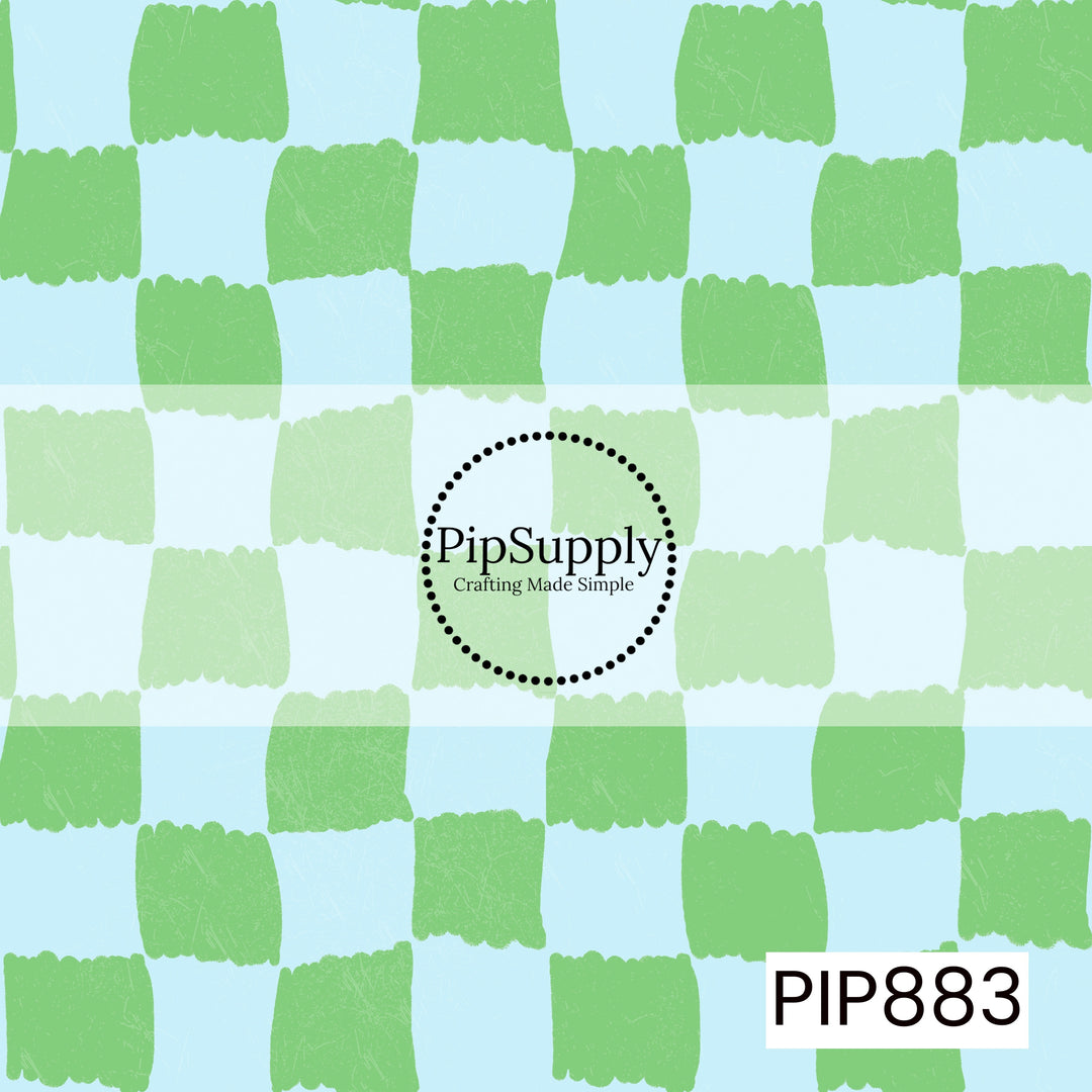 A playful hand-painted checkerboard pattern featuring alternating soft sky blue and fresh pastel green squares. The checks have irregular, brushstroke-style edges that create an organic, handcrafted appearance. A subtle distressed texture is layered throughout, adding depth and a lightly weathered finish. Bright, airy, and cheerful with a refreshing coastal-inspired color palette.
