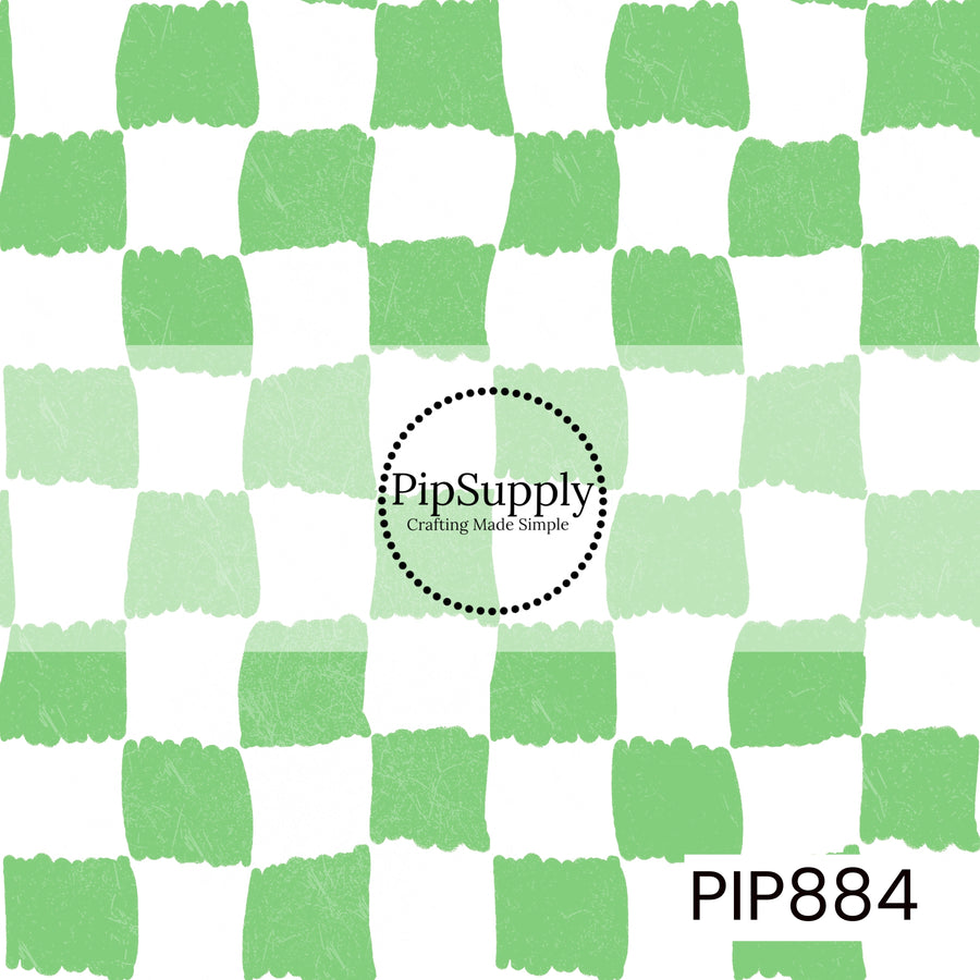 A playful hand-painted checkerboard pattern featuring alternating crisp white and fresh pastel green squares. The checks have irregular, brushstroke-style edges that create an organic, handcrafted appearance. A subtle distressed texture is layered throughout, adding depth and a lightly weathered finish. Clean, bright, and refreshing with a classic yet modern color palette inspired by coastal charm and springtime freshness.

