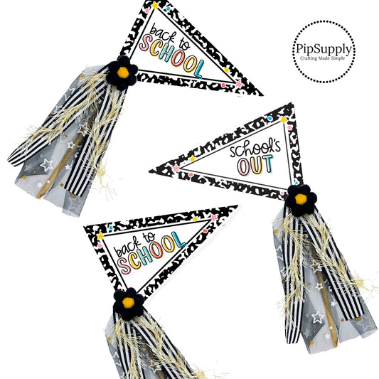 Back to school pennant flags DIY kits - Black and white with bright colored words on a dowel stick with felt flower and glittery ribbons.