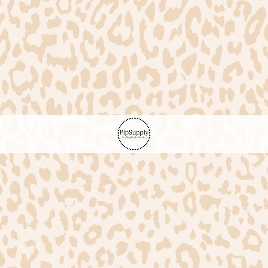 This classic leopard pattern themed fabric by the yard features cream colored leopard print. This fun Valentine's Day themed fabric can be used for all your sewing and crafting needs! 