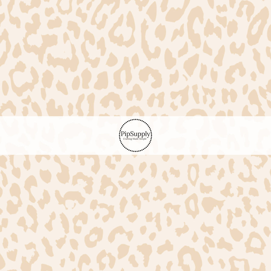 This classic leopard pattern themed fabric by the yard features cream colored leopard print. This fun Valentine's Day themed fabric can be used for all your sewing and crafting needs! 