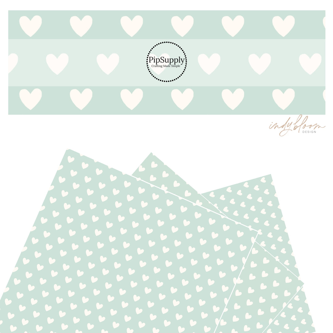 These Valentine's pattern themed faux leather sheets contain the following design elements: white hearts on pastel aqua. Our CPSIA compliant faux leather sheets or rolls can be used for all types of crafting projects.