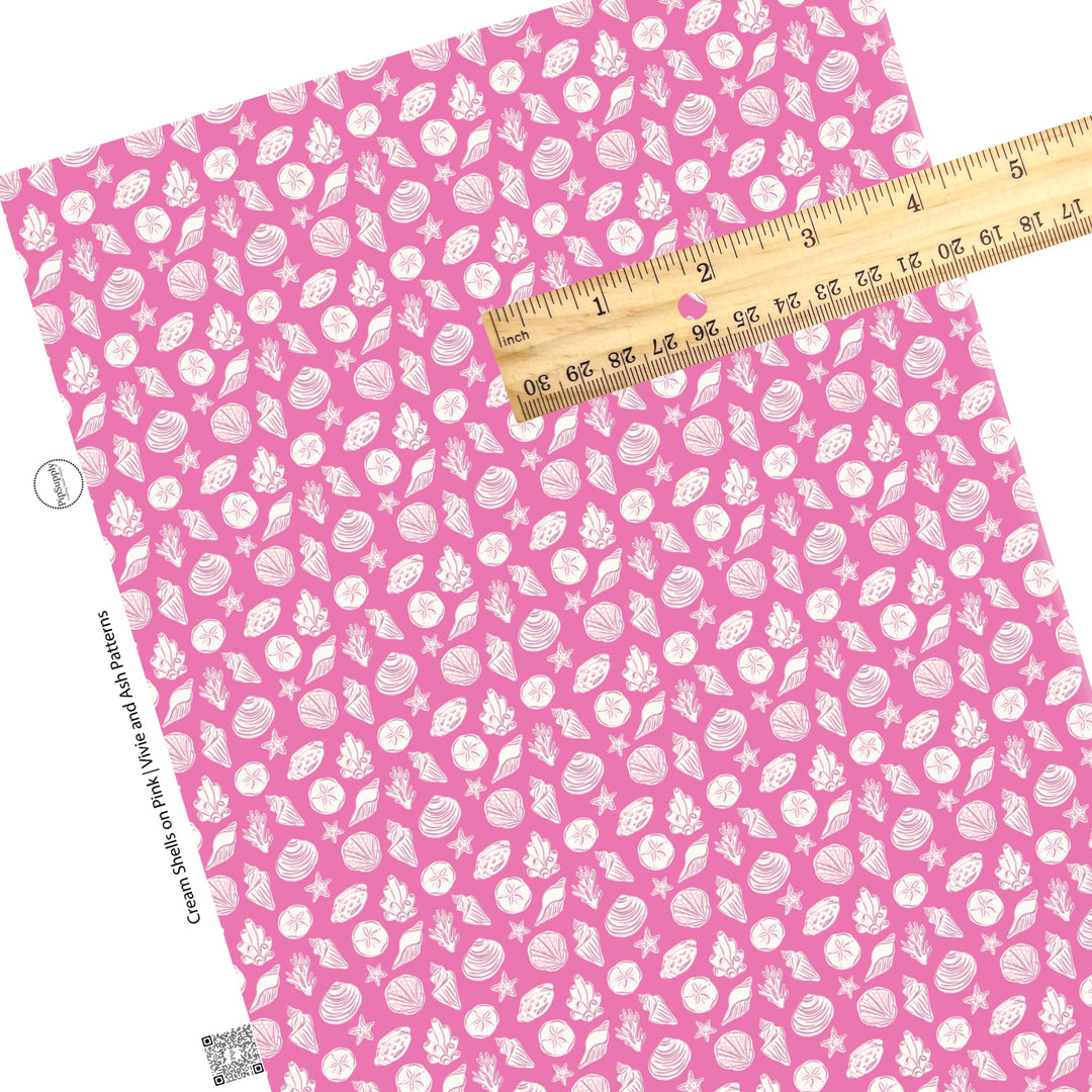 These beach faux leather sheets contain the following design elements: white seashells on pink. Our CPSIA compliant faux leather sheets or rolls can be used for all types of crafting projects.