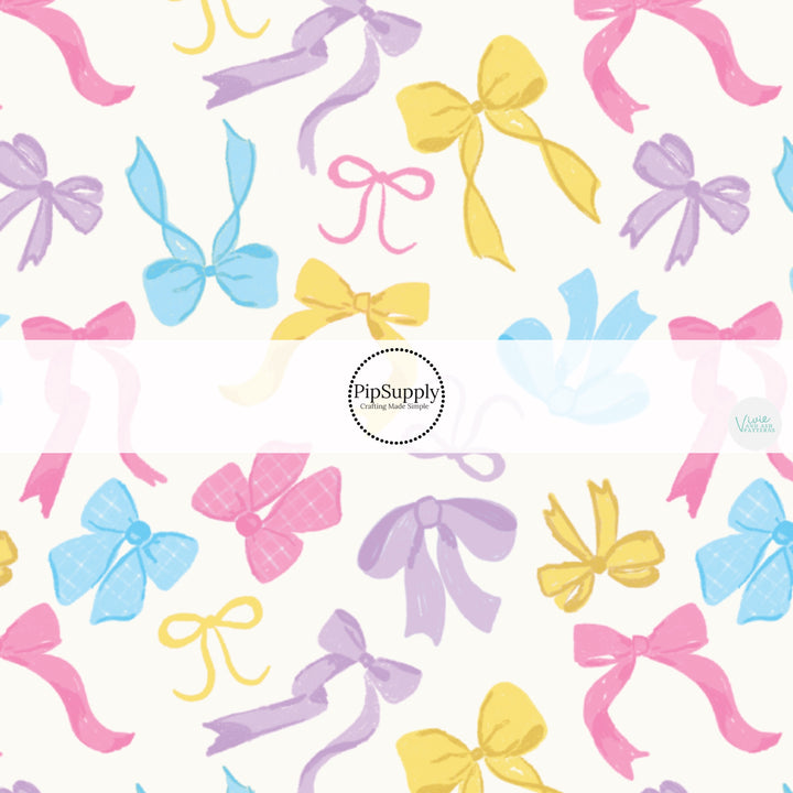 Yellow, Pink, Purple, and Blue Girly Bows on Cream Fabric by the Yard.