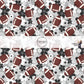 Gray fabric by the yard with footballs and black, white, and gray florals.
