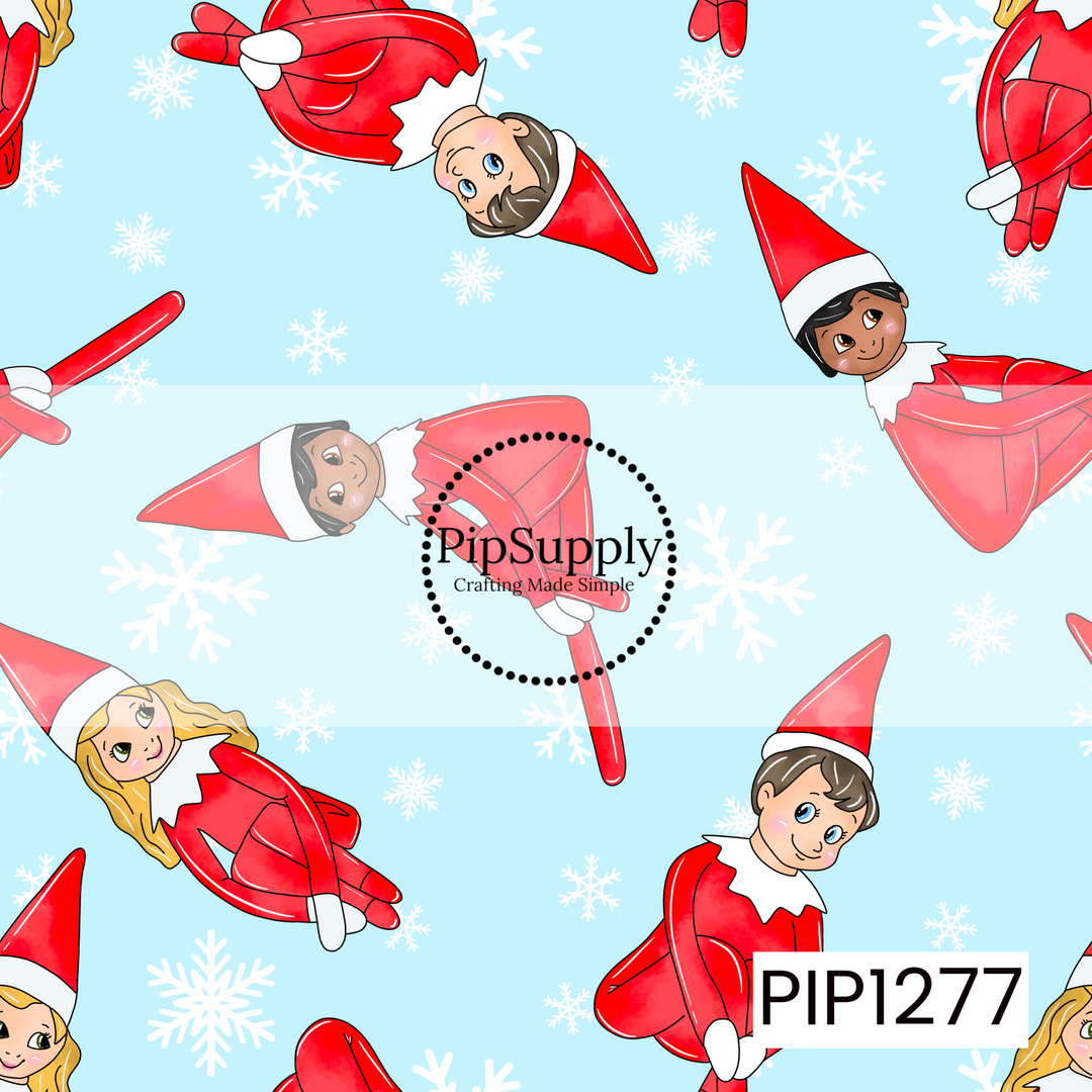 A playful Christmas pattern featuring cheerful little holiday elves in bright red outfits and pointed hats scattered across a soft icy blue background. White snowflakes in varying sizes are sprinkled throughout, giving the design a sweet and whimsical winter feel.
