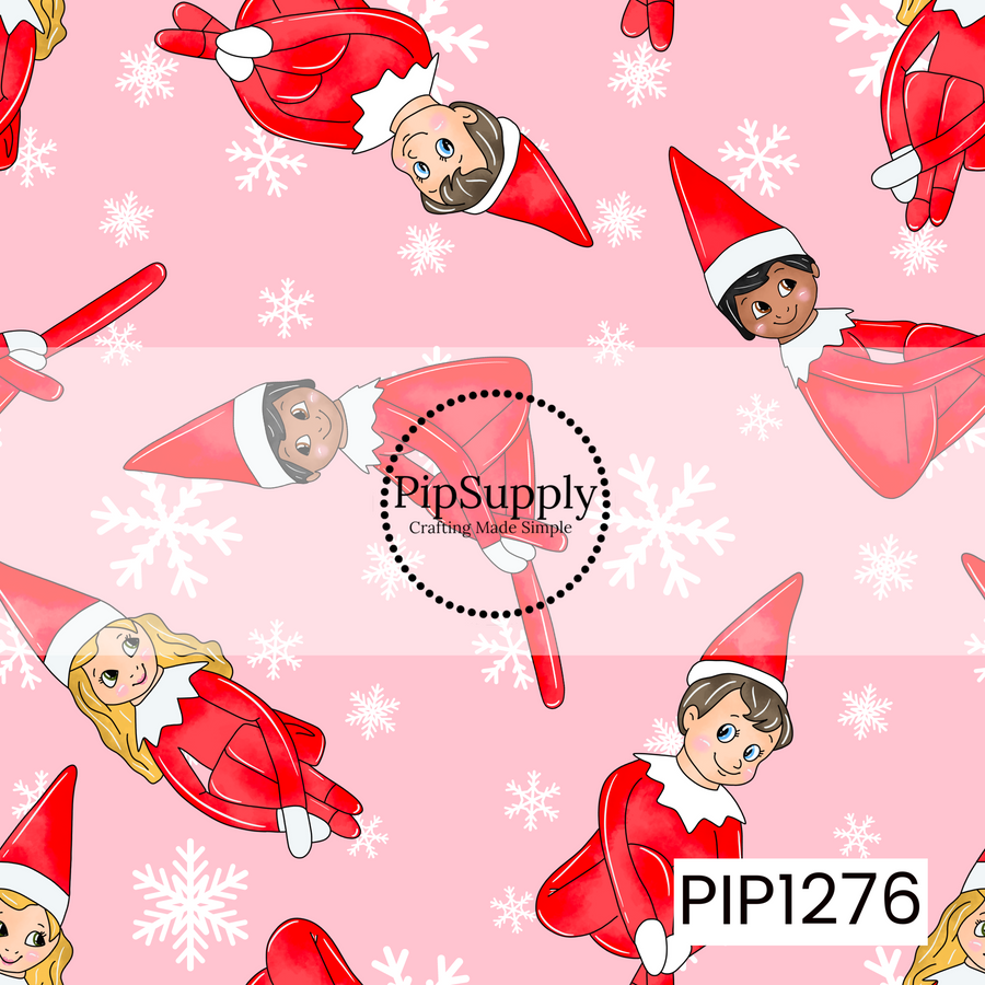 A playful Christmas pattern featuring cheerful little holiday elves dressed in bright red outfits and pointed hats, scattered across a soft pink background. White snowflakes in a mix of sizes fill the spaces between the elves, giving the design a fun, whimsical winter feel.
